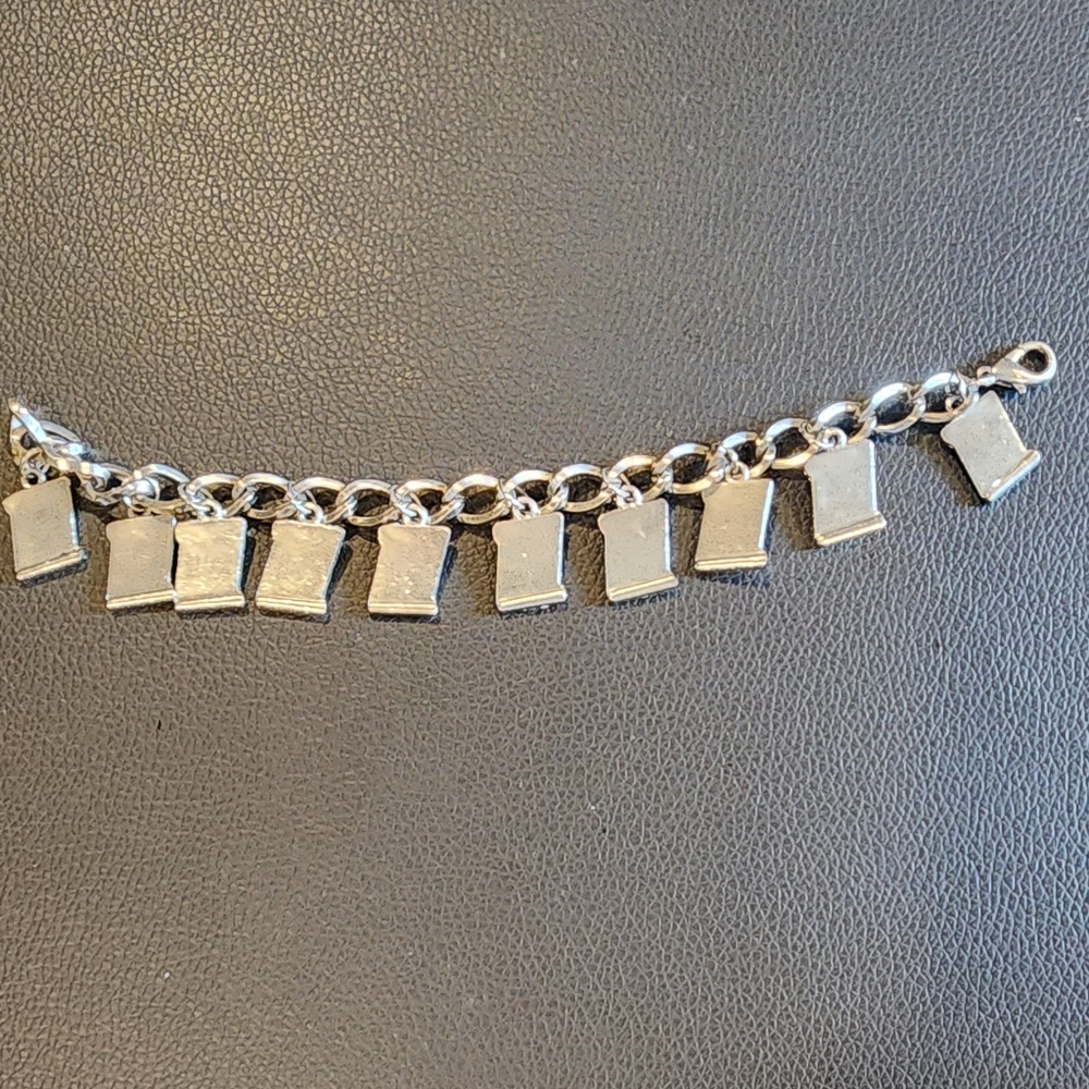 Ladies silver tone link bracelet with the 10 commandments